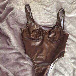 Brown leather bodysuit